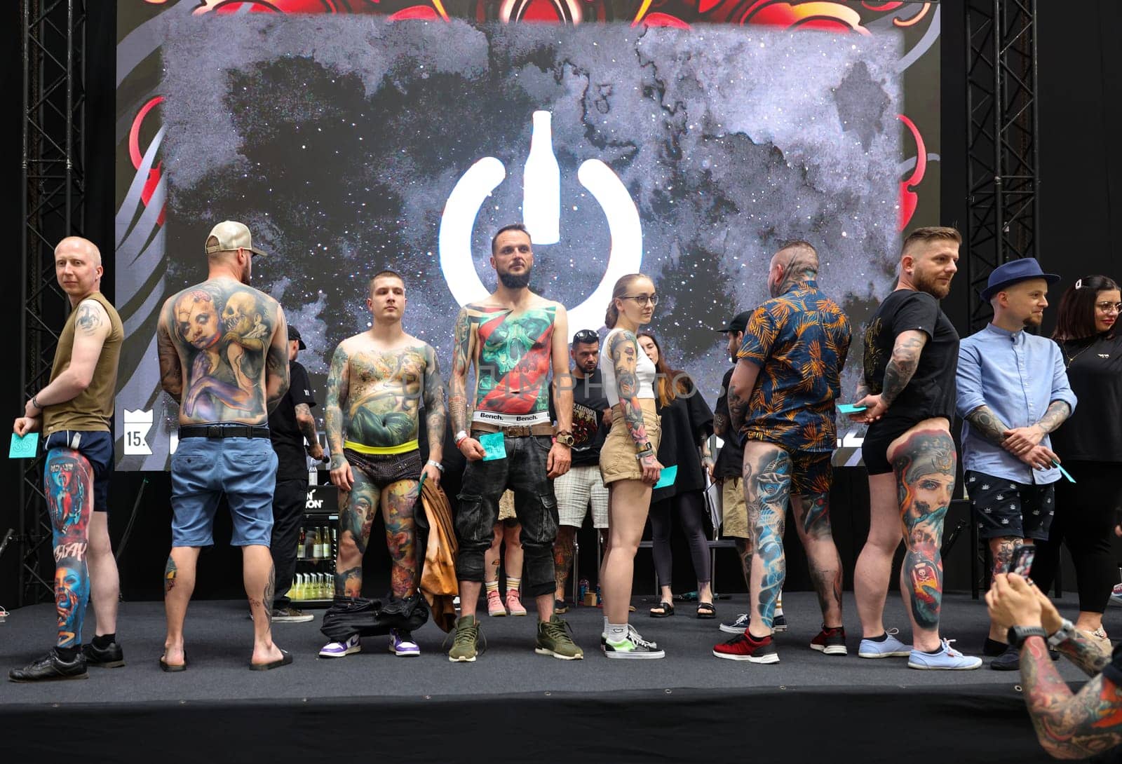Krakow, Poland - June 12, 2022: Unidentified participants during the contest for the best tattoo at the 15th Tattoofest Convention in Cracow. One of the most prestigious tattoo festivals.