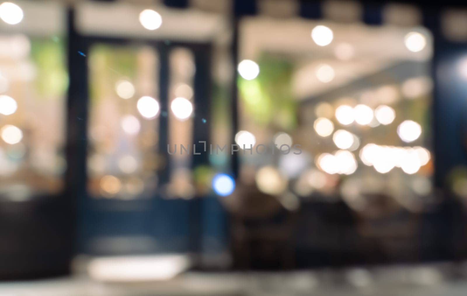Defocused image of shop or cafe with bokeh coloful night lights background