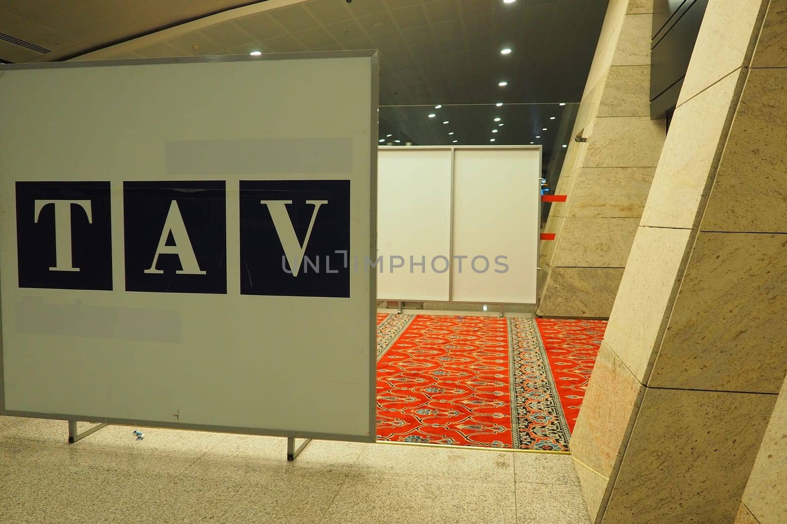 Ankara, Turkiye, Esenboga Havalimani Airport, 01.18.2023 Empty prayer hall at night. Namaz or salat is a prayer in Islam. Isha prayer. Red prayer carpet. Nobody at night. Sajjada, namazlik, jai-namaz.