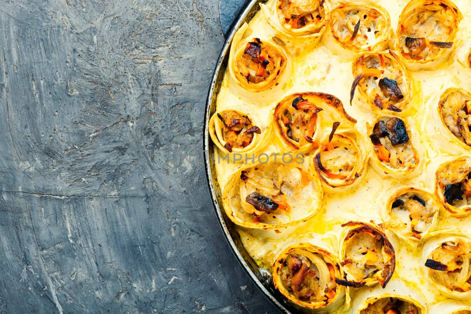 Vegetables baked with cheese in pita bread. Casserole in a pan. Space for text