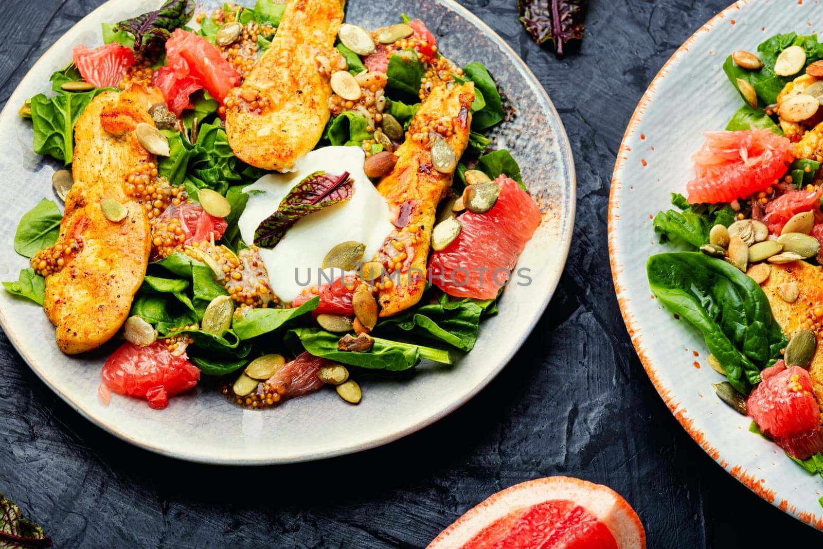 Meat salad with chicken breast, lettuce and citrus fruits. Healthy and detox food concept