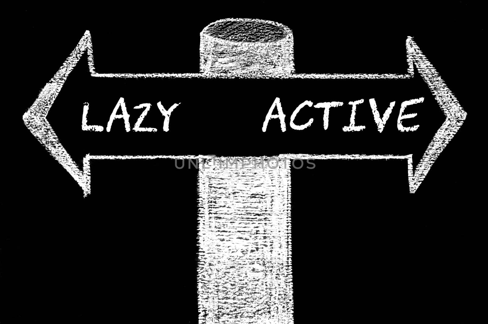 Opposite arrows with Lazy versus Active. Hand drawing with chalk on blackboard. Choice conceptual image