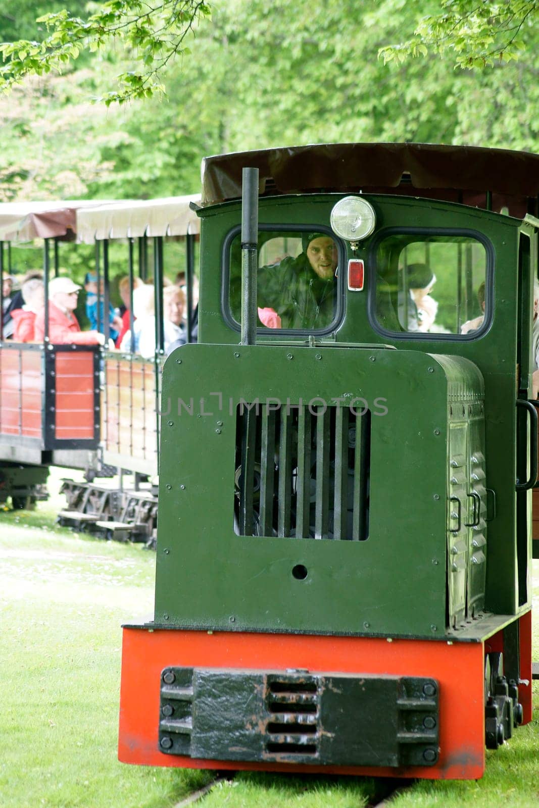 Berlin,Germany – May 06,2015: The park railway of the Britzer Garten in Berlin's Neukölln district with visitors and tourists on May 6,2015 in Berlin.