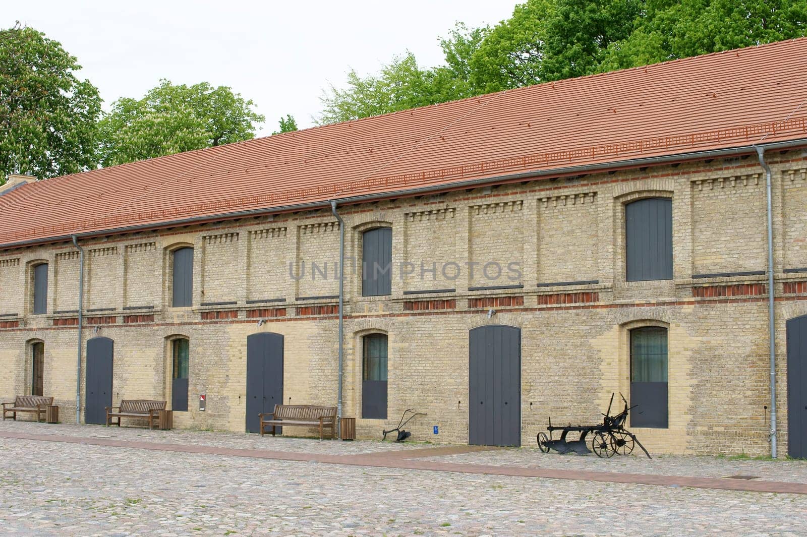 The exterior of the stables of a riding stable.