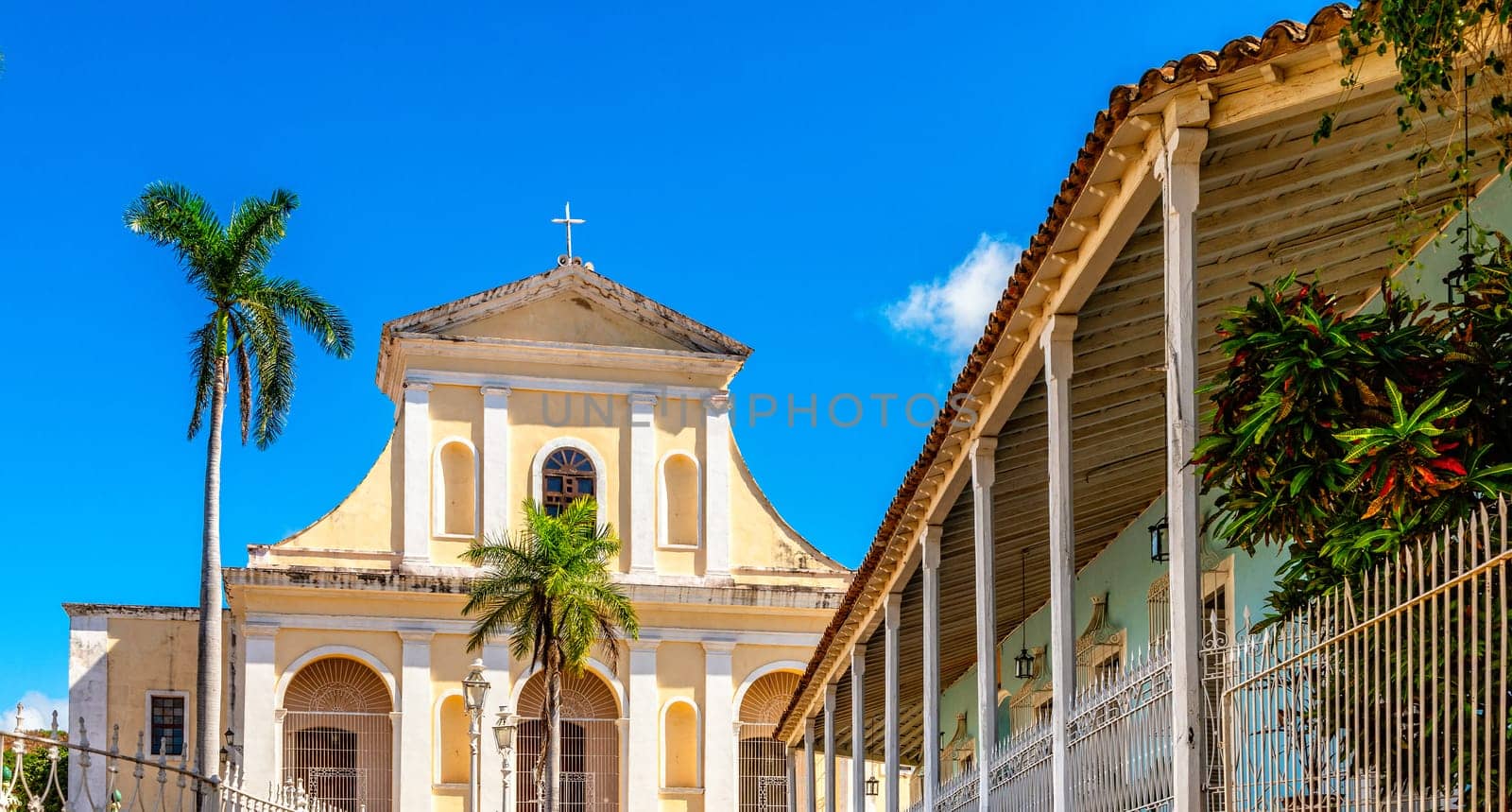 Trinidad central square with palms and Church of the Holy Trinity cathedral, Trinidad, Cuba