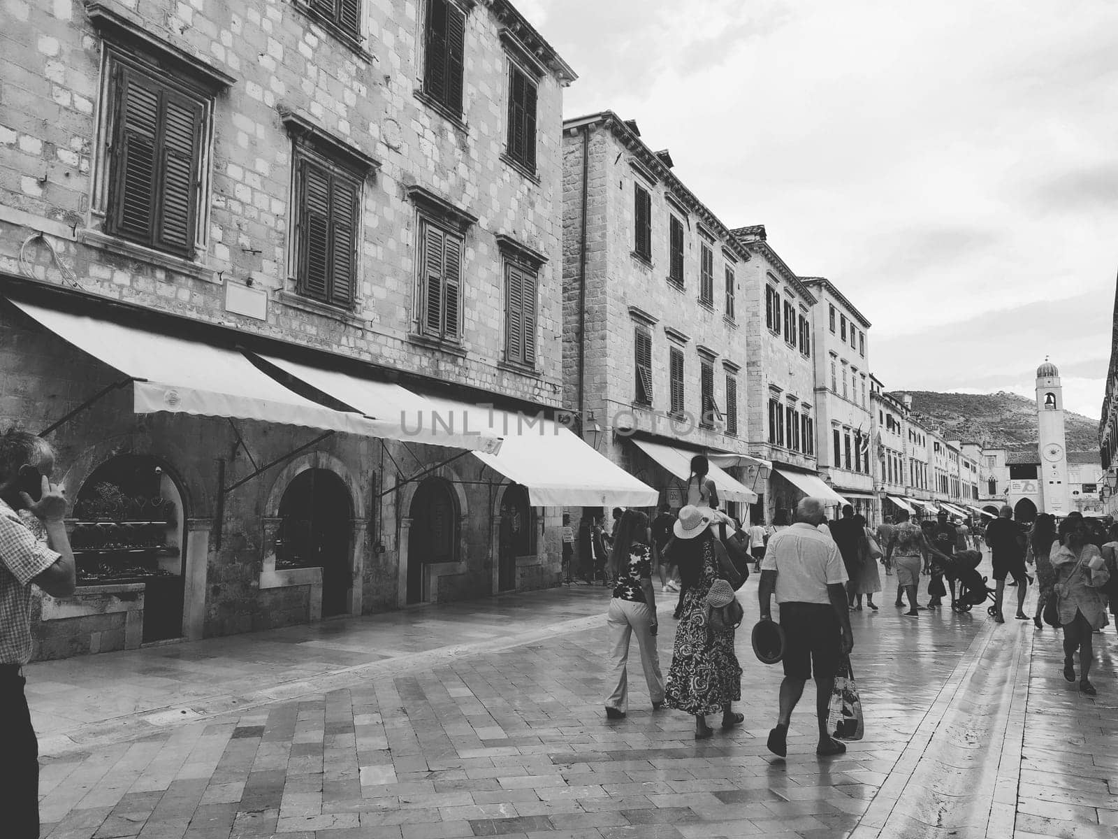 Stradun, Stradone is the main street of the historic city center of Dubrovnik in Croatia. architectural sights. A popular place for tourist walks. People are walking August 14, 2022 Black and white.