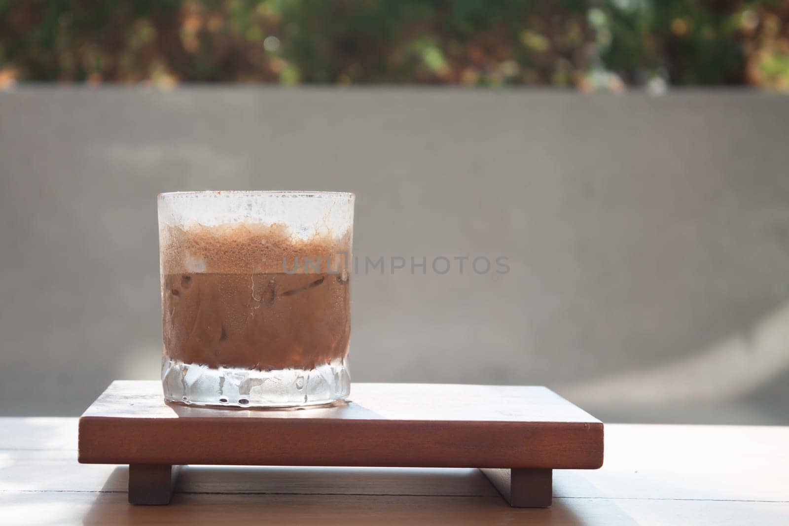 Iced coffee with micro foam in coffee shop, stock photo