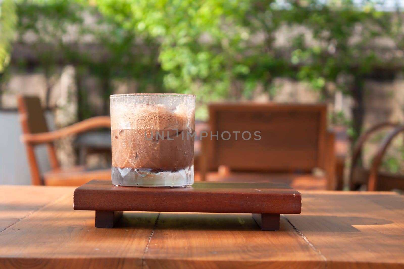 Iced coffee with micro foam in coffee shop, stock photo