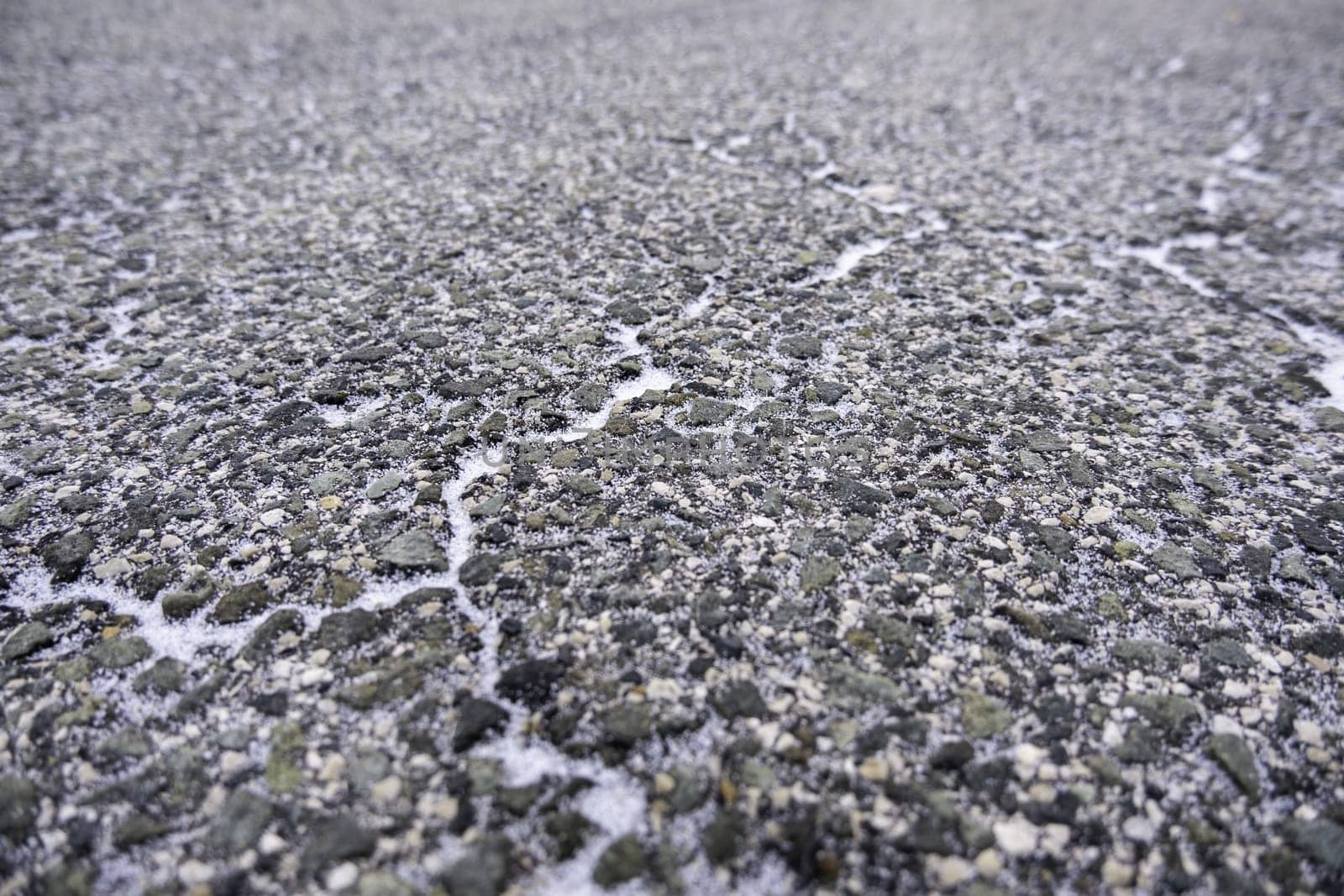 Detail of frozen mountain road in winter