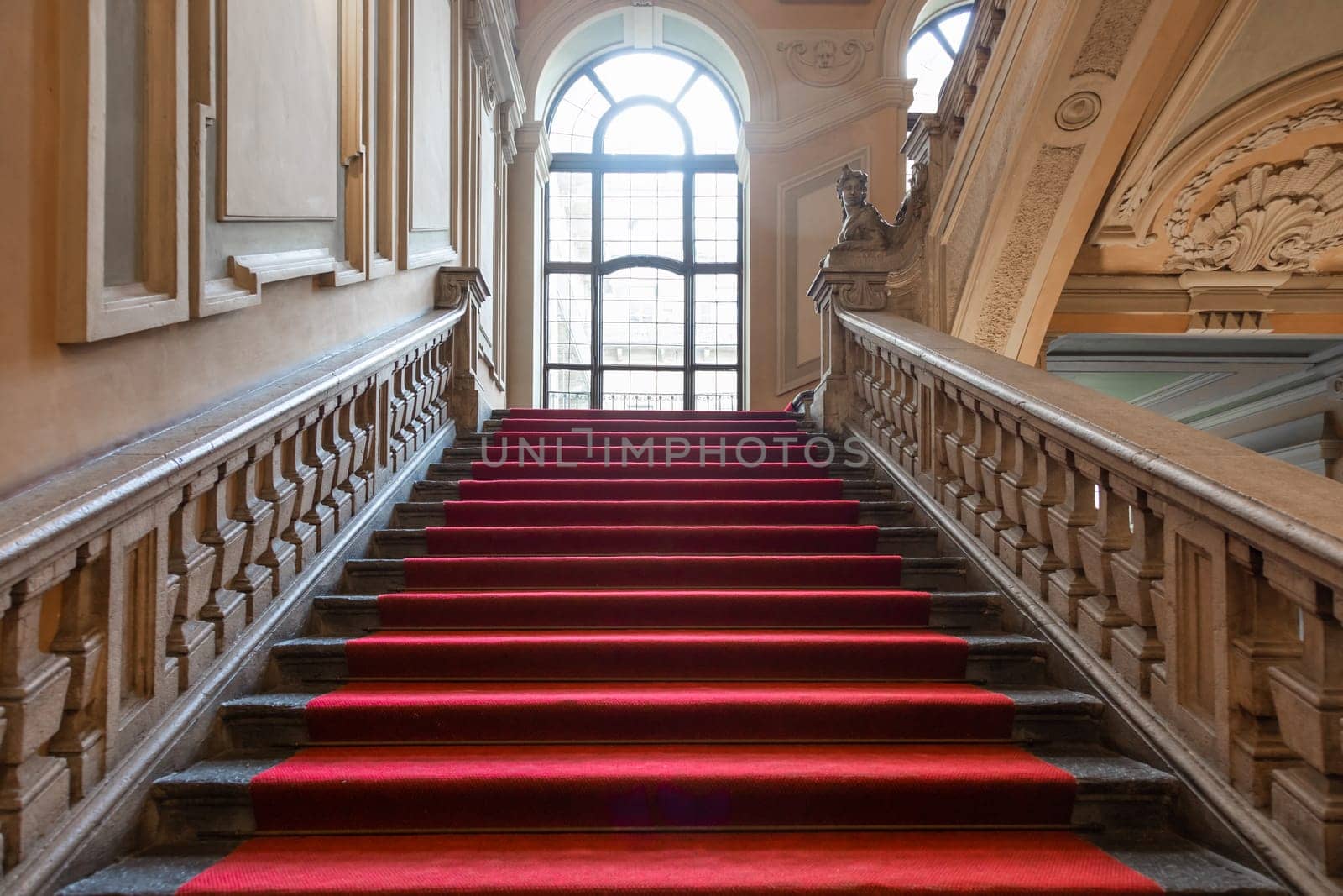 Turin, Italy - January 2023: Palazzo Barolo staircase. Luxury palace with old baroque interior and red carpet