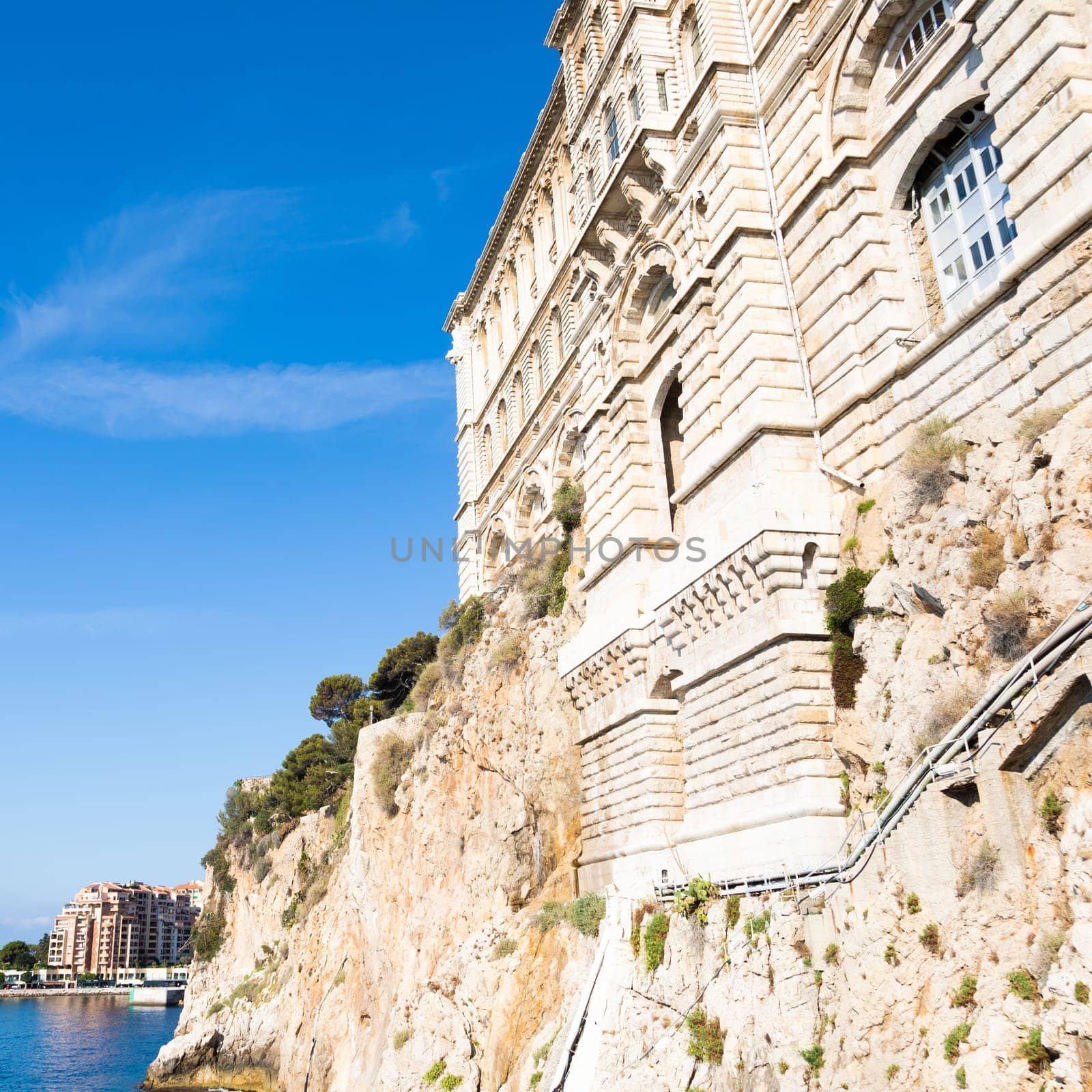 Principality of Monaco - Oceanographic Museum exterior with panorama, blue sea and sky