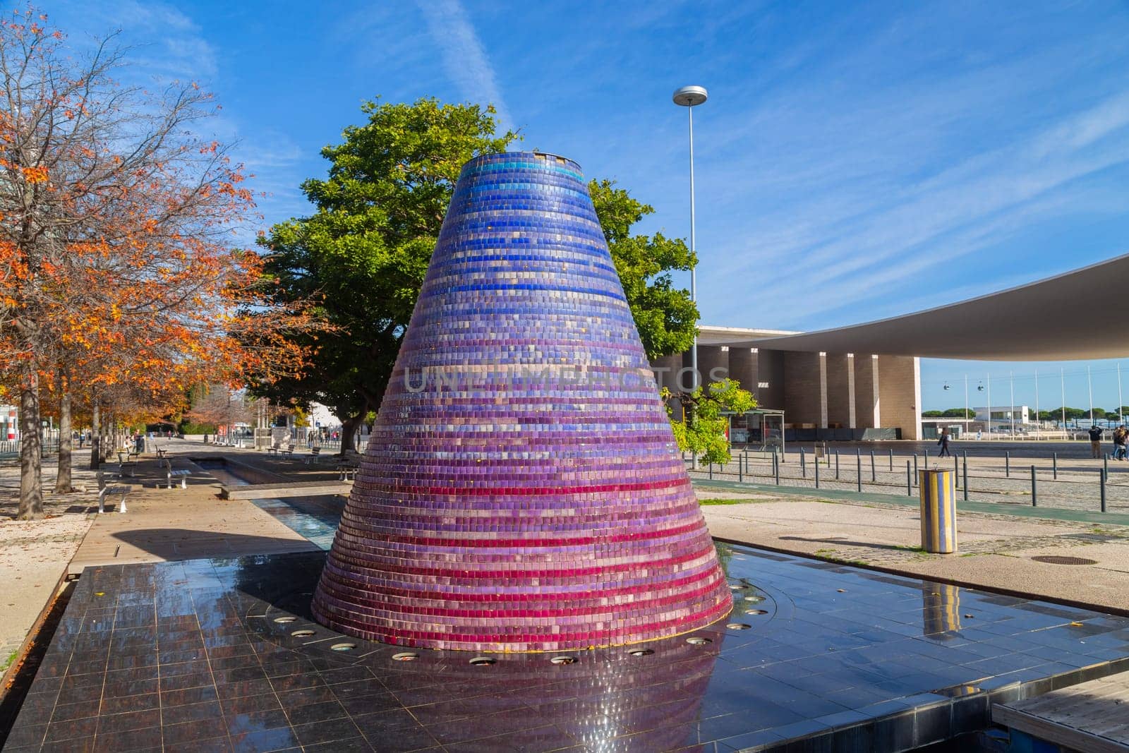 Lisbon, Portugal - November 26, 2022: One of the Water Volcanoes, a popular attraction among visitors, especially children and the Portugal Pavillion on the back. Park of Nations