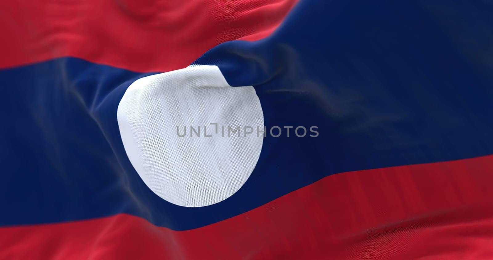 Detail of of the Laos national flag waving in the wind. The Lao People Democratic Republic is a state in Southeast Asia. Rippled fabric. Textured background. Realistic 3d illustration. Close-up