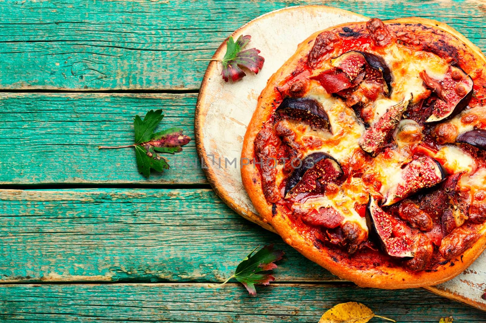 Homemade meat pizza with figs. Flatbread with figs, copy space
