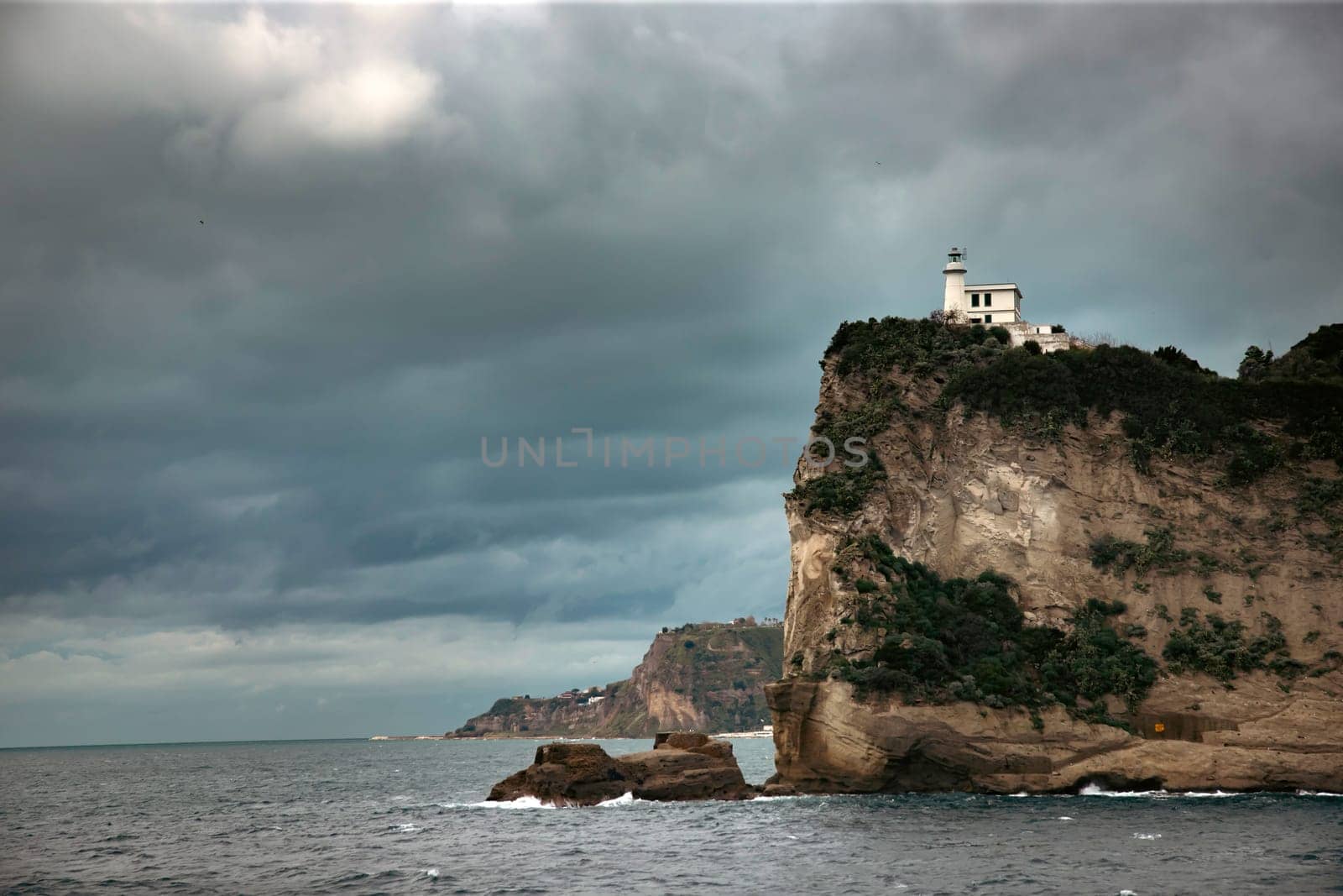 Capo Miseno and its lighthouse that marks the northwestern limit of the Gulf of Naples, Italy