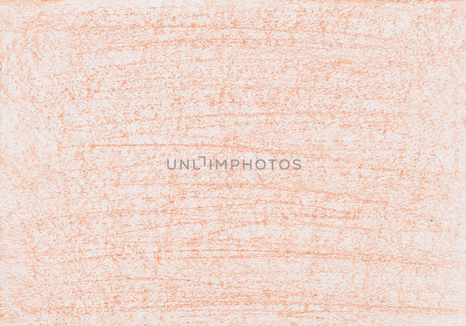 Texture from wax crayon paint in orange color on a white sheet of paper