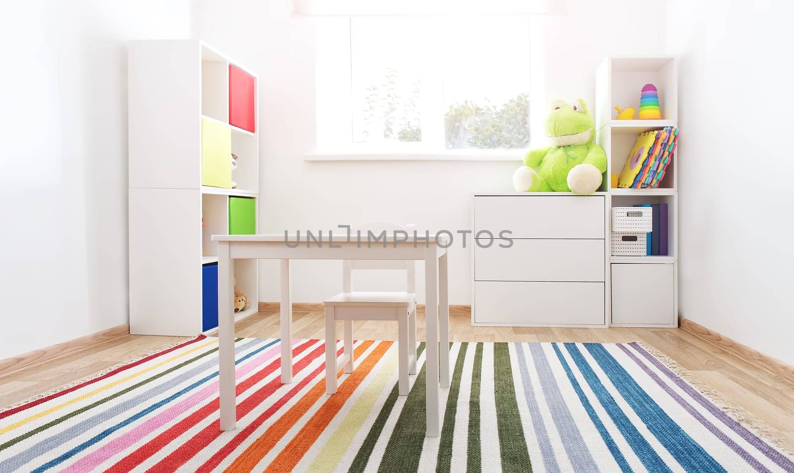 Comfortable room with colourful furniture in sunny day. Concept of the child room and kindergarten.