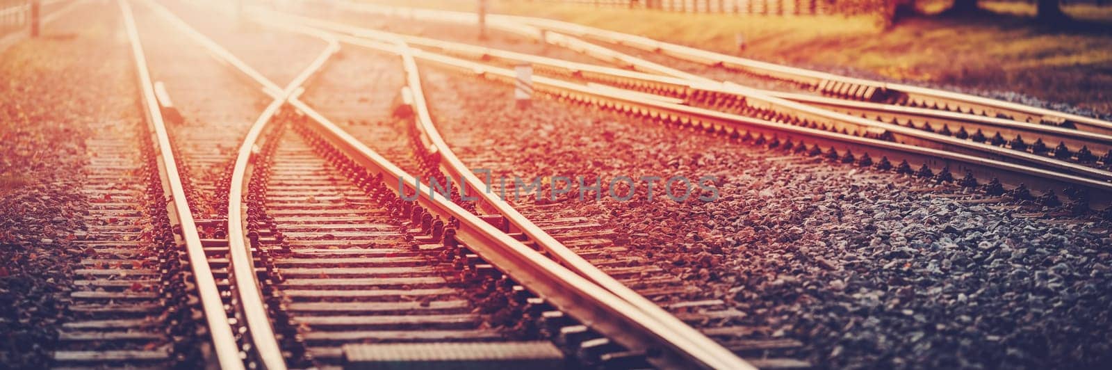 Panoramic view of the crossing railway in sunset in summer. Concept of logistic and transportation.