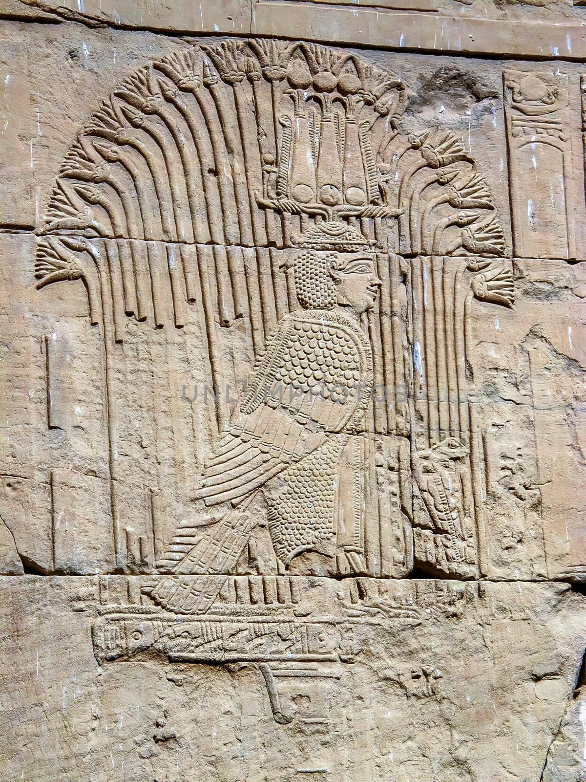 Human head bird body representing an ancient Egyptian mythological god carved on the wall of the Kom Ombo temple near Aswan. Egypt.