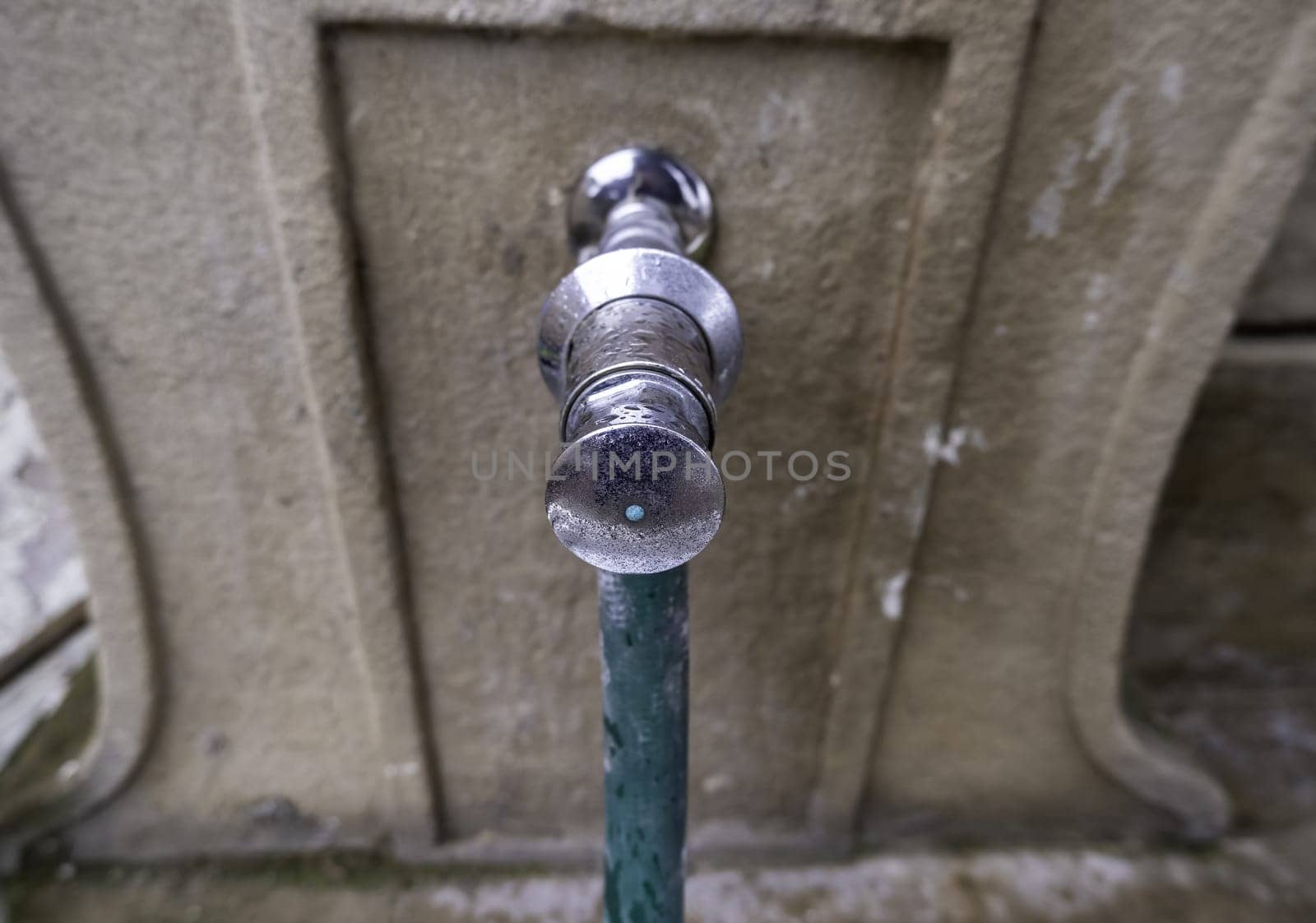 Detail of water tap in the street, drinking water