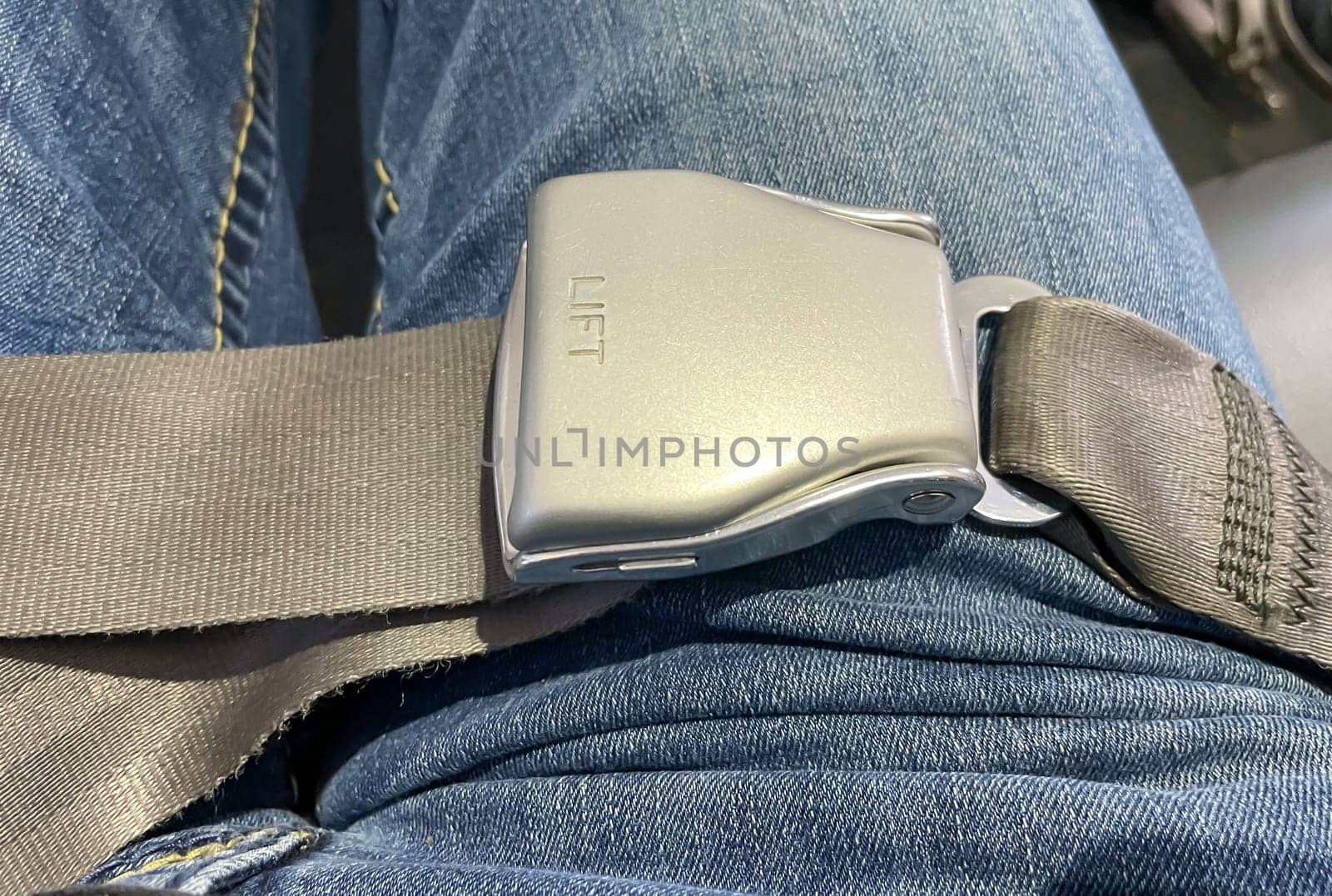 The belt in an airplane with which passengers are supposed to secure themselves during the flight.