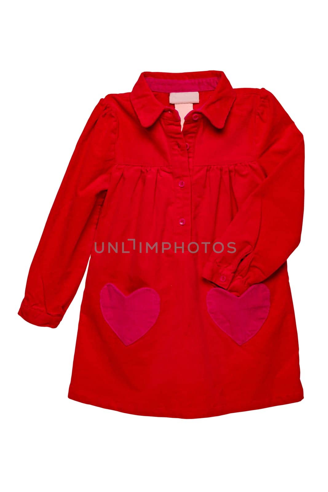 Summer dress isolated. A beautiful red girl's dress with attached heart shaped pockets and long sleeves isolated on white. Clipping path. Kids spring and autumn fashion.