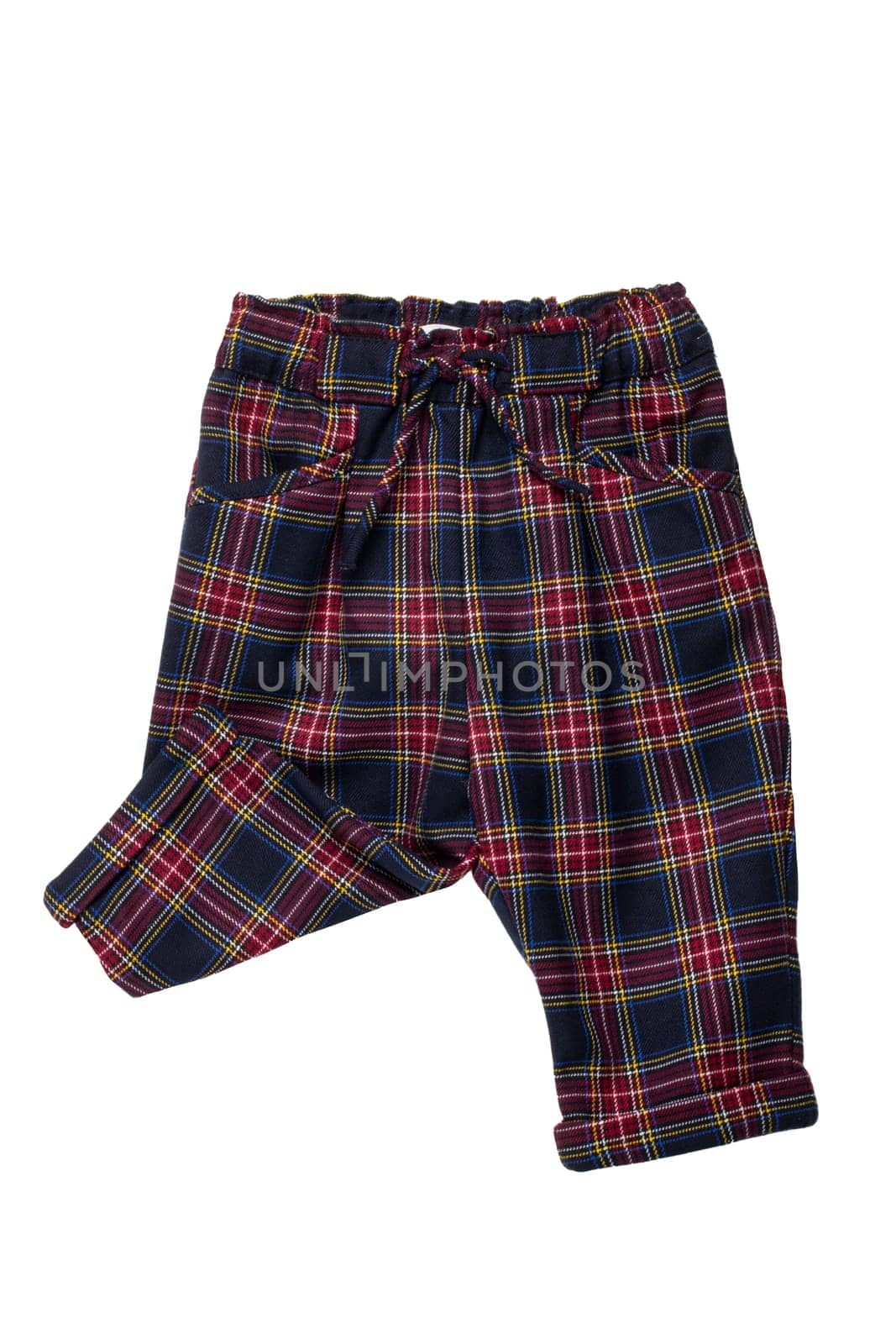 Summer shorts isolated. Close-up of a stylish fashionable plaid short pants with elastic and bow. Clipping path.Tartan checkered fabric texture background.