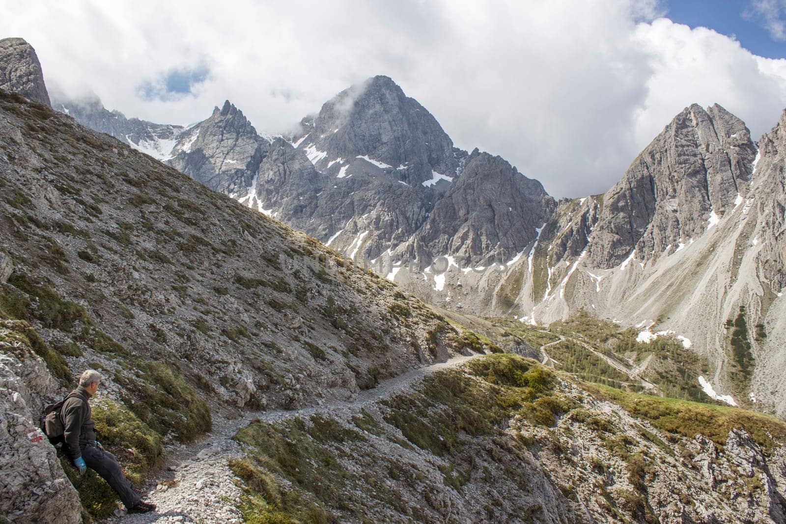 man trekking in the mountains, Alps in Austria, Lienzer Dolomiten, East Tyrol