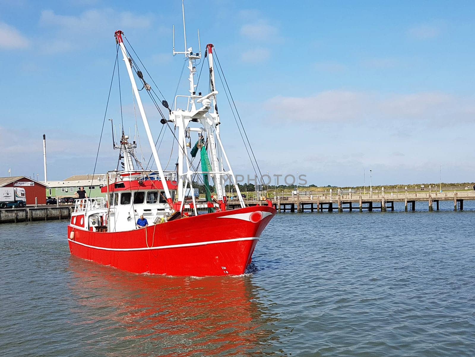Fishing boat in the harbour of the island of Roemoe in Denmark. Fishing boat in the harbor of Roemoe island in Denmark.