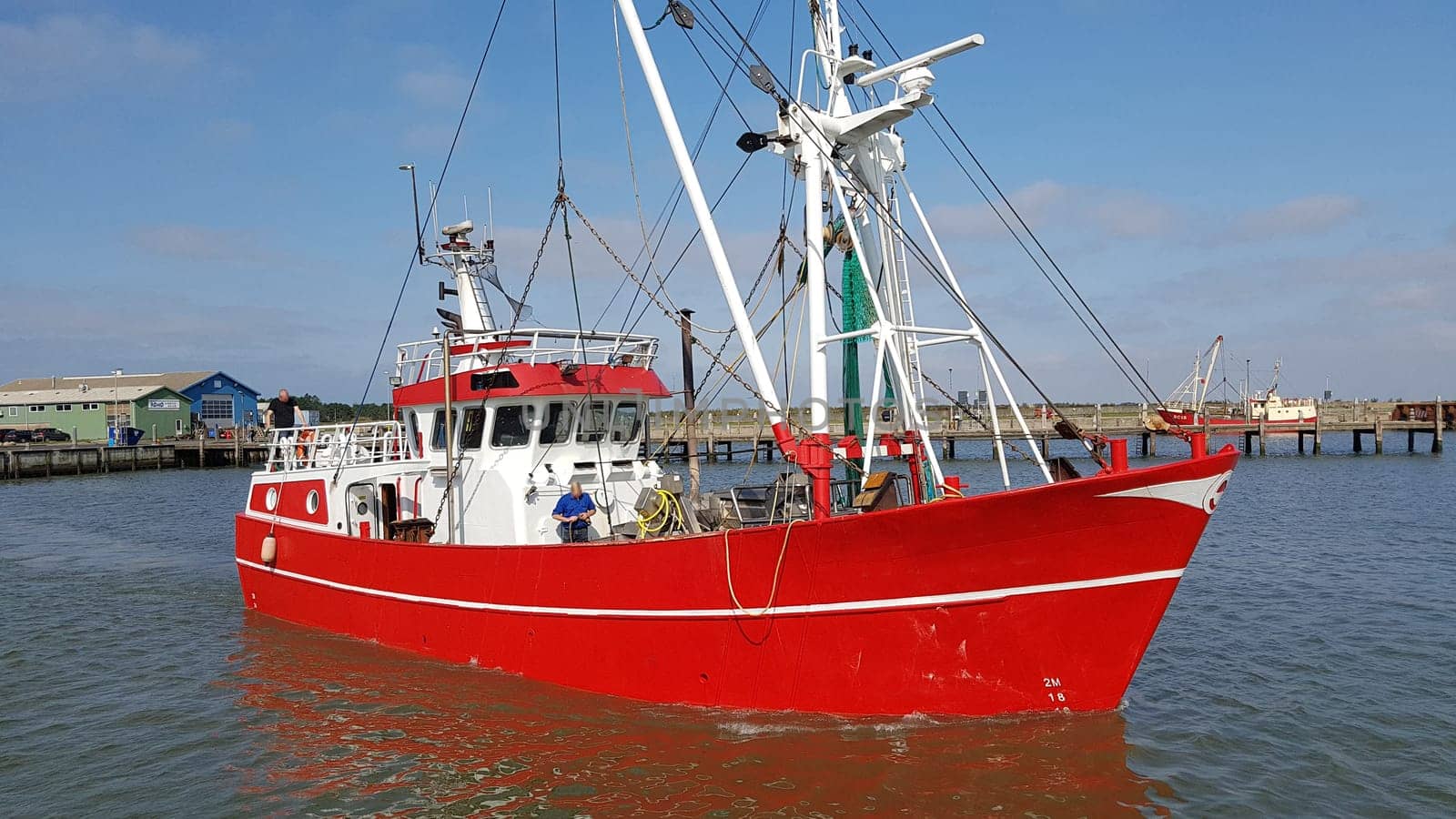 Fishing boat in the harbour of the island of Roemoe in Denmark. Fishing boat in the harbor of Roemoe island in Denmark.