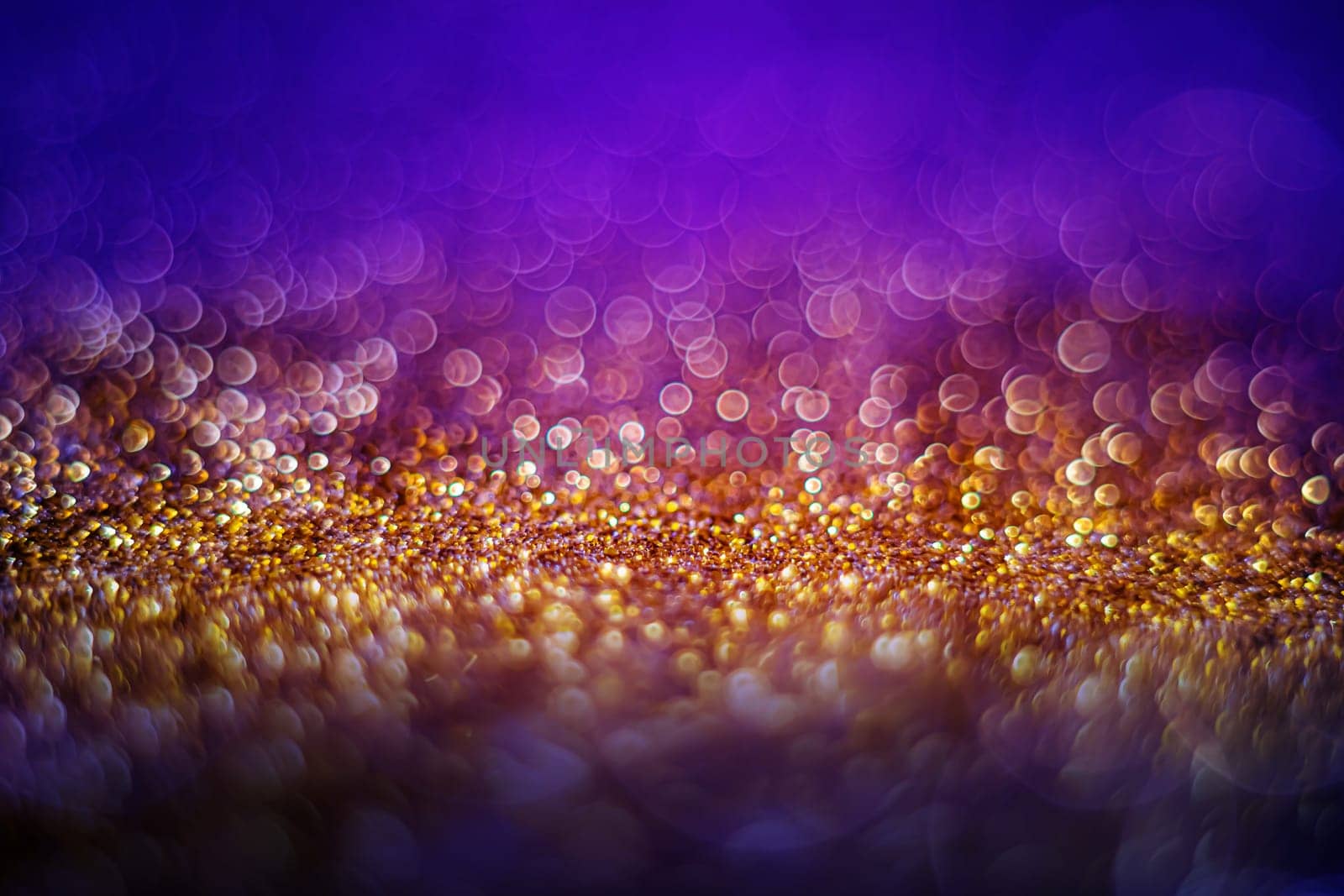 Glitter light abstract gold bokeh christmas light blurred background