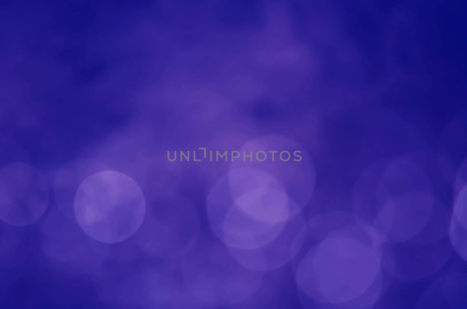 Light abstract dark bokeh christmas circle color glitter blurred black background