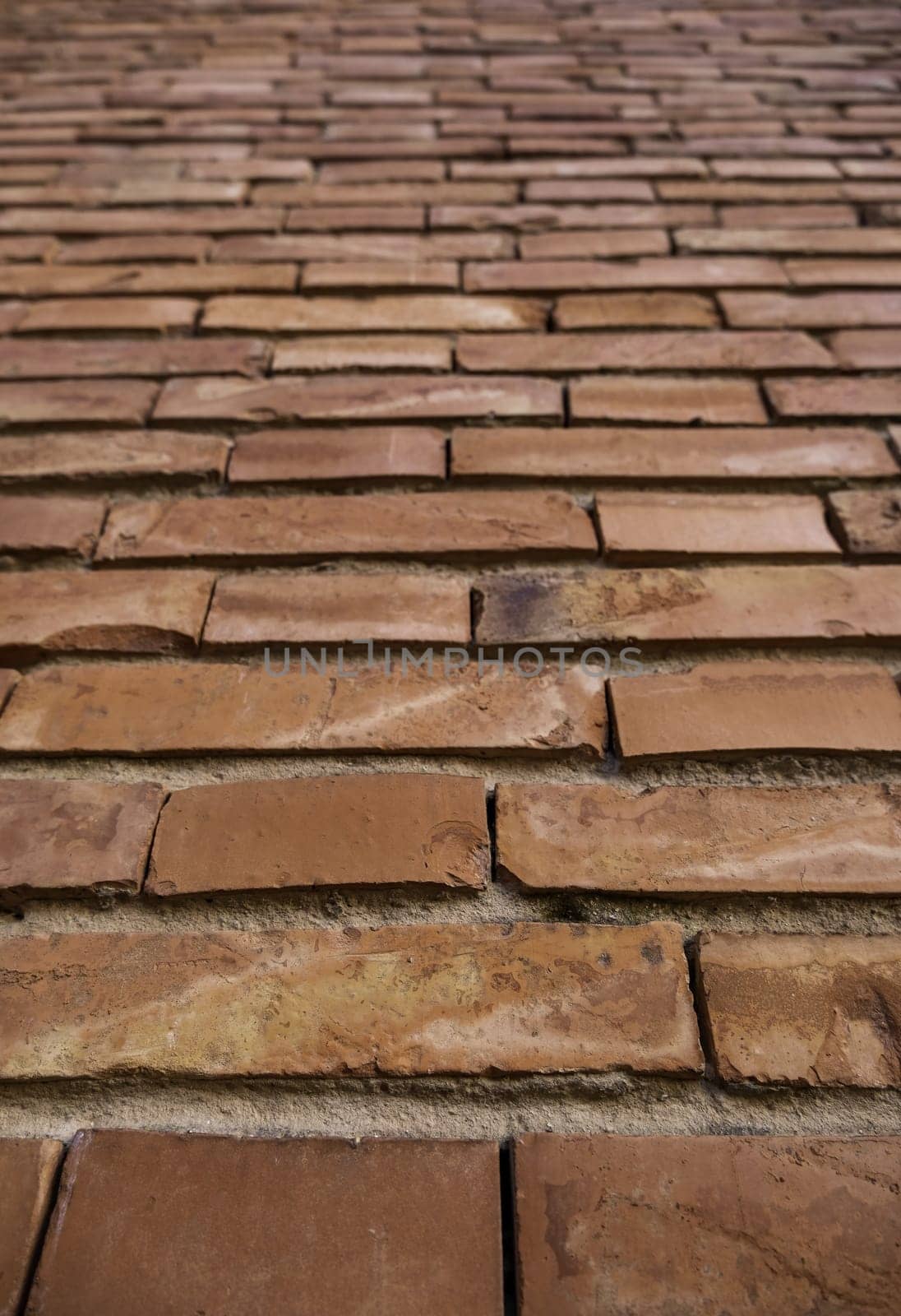 Detail of wall background with mud bricks, construction