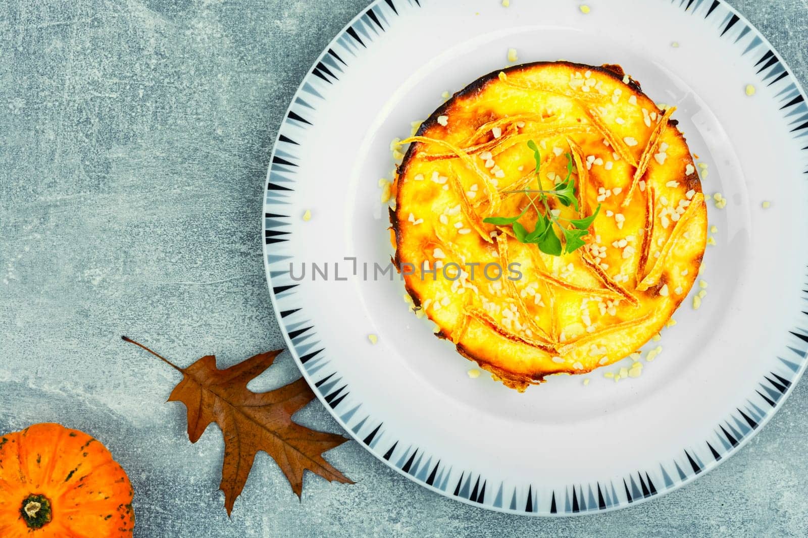 Baked casserole with pumpkin and cottage cheese. Autumn baking with pumpkin.