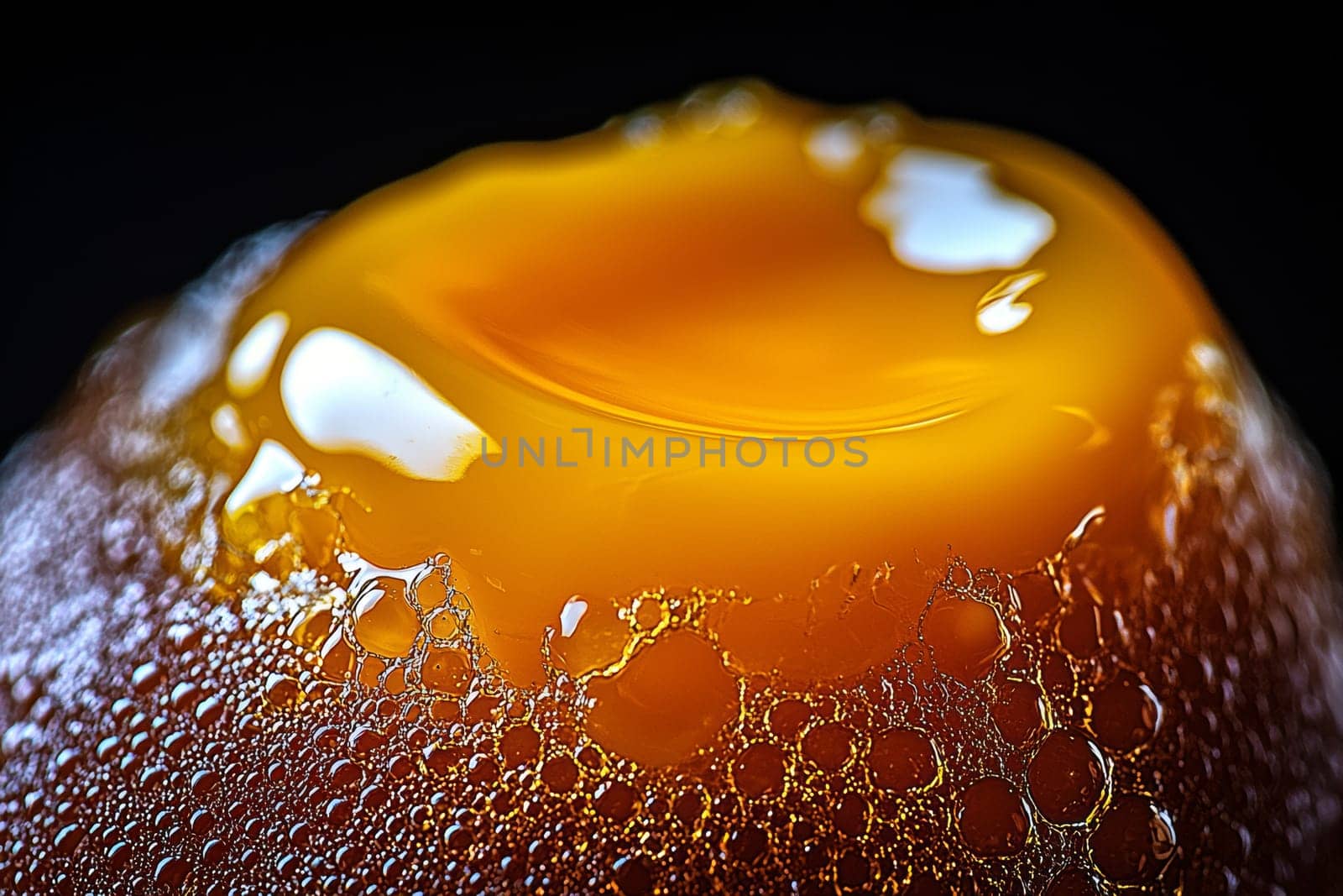 Golden honey drips elegantly, creating a glossy surface adorned with bubbles, showcasing its rich color and texture in exquisite detail.