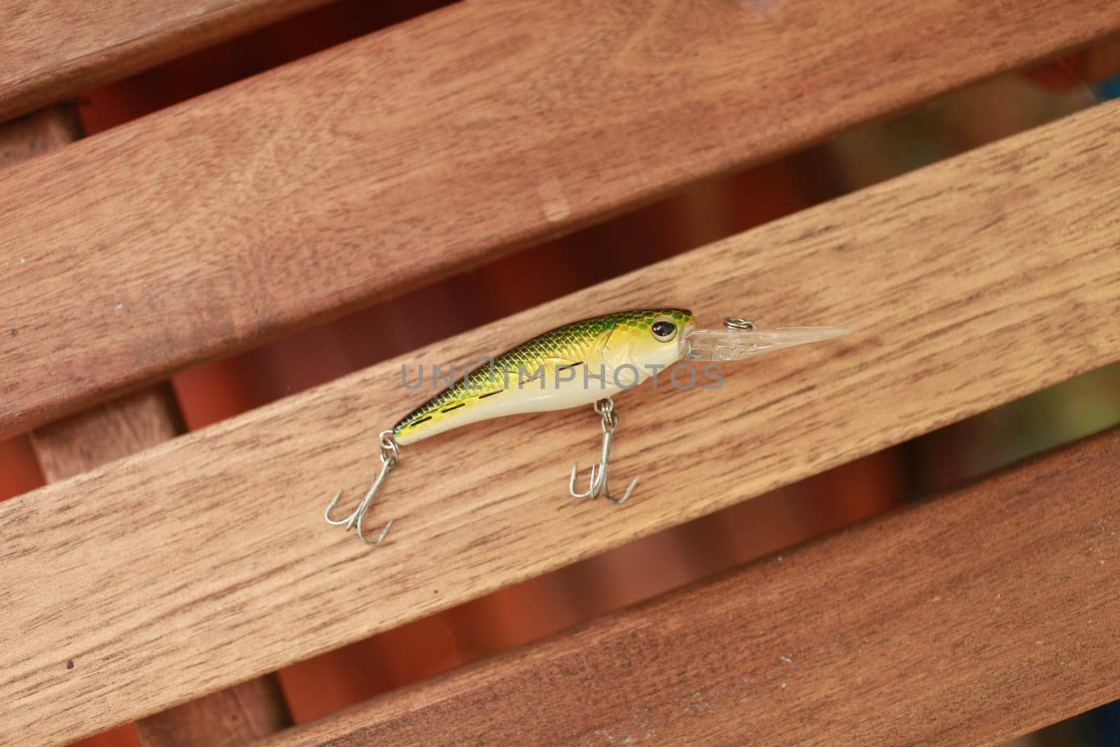 artificial small fish with sharp fishing hooks is a wobbler for catching predatory fish