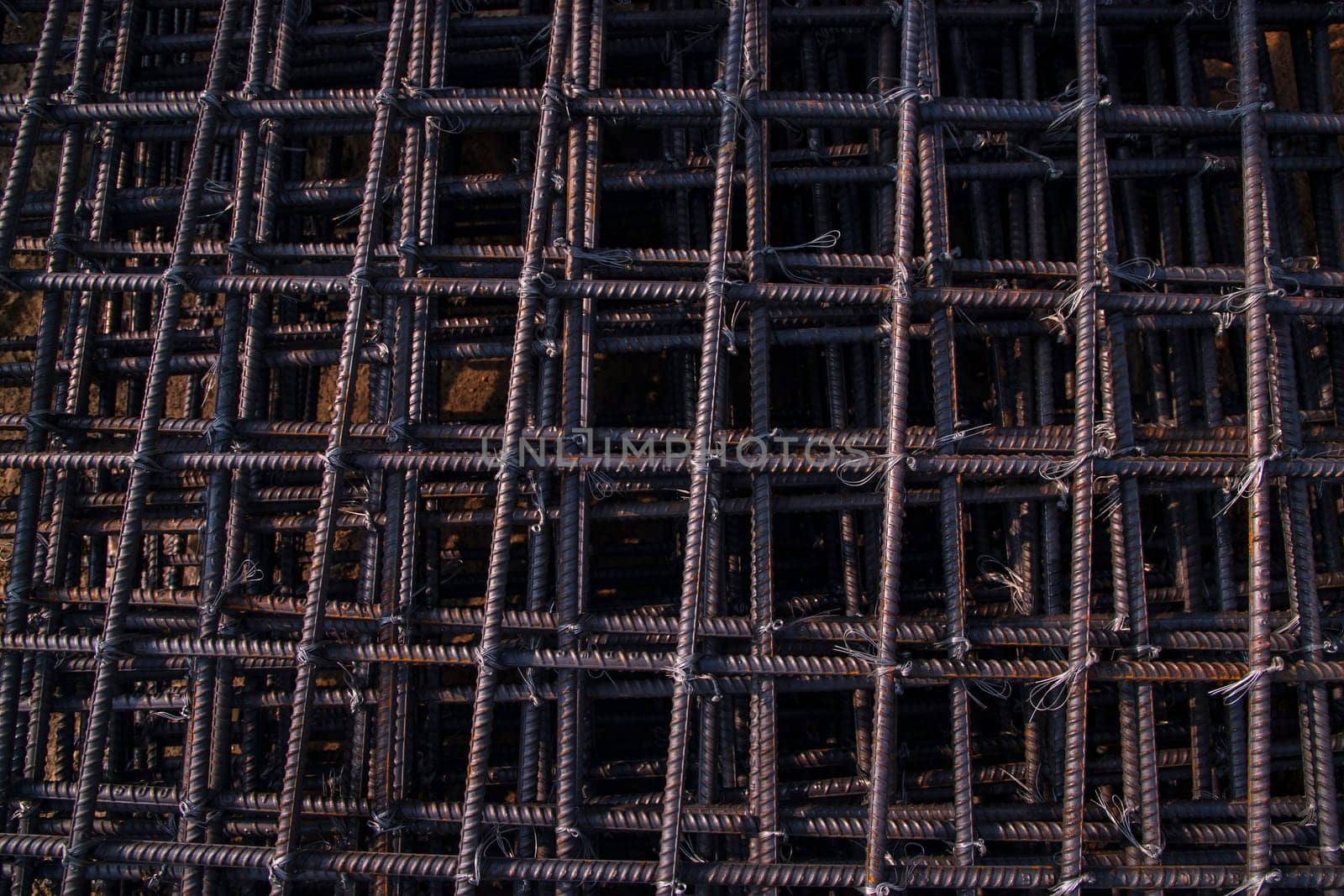 Steel mesh for reinforcement concrete in construction site, closeup of photo