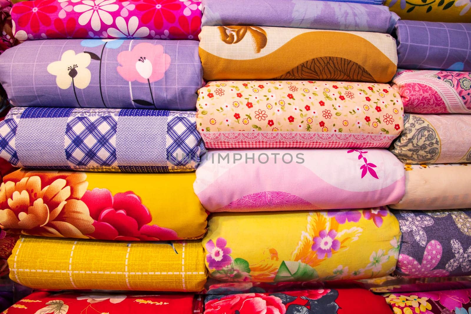 Artistic variety shade tone colors Bed sheets stacked on retail Shop Shelf to sale