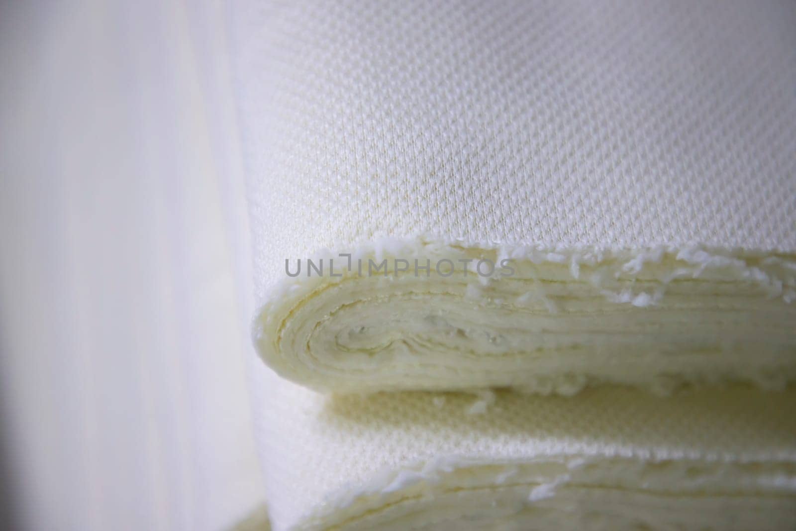 Close-up focus folded stacked sherpa fabric backdrop pattern textured  can be used as a background wallpaper