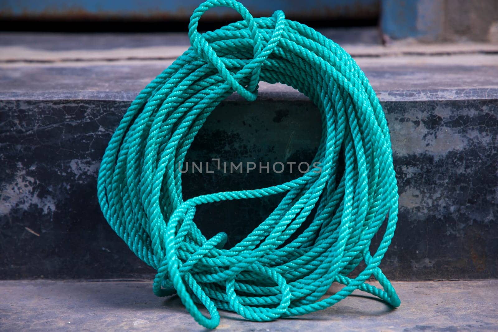 green rope on the cement floor background, vintage color tone.