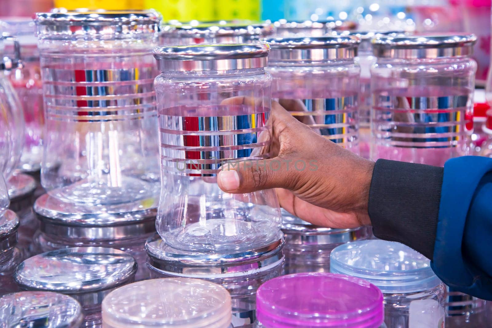 Transparent Plastic jur on a shelf in a supermarket, closeup of photo
