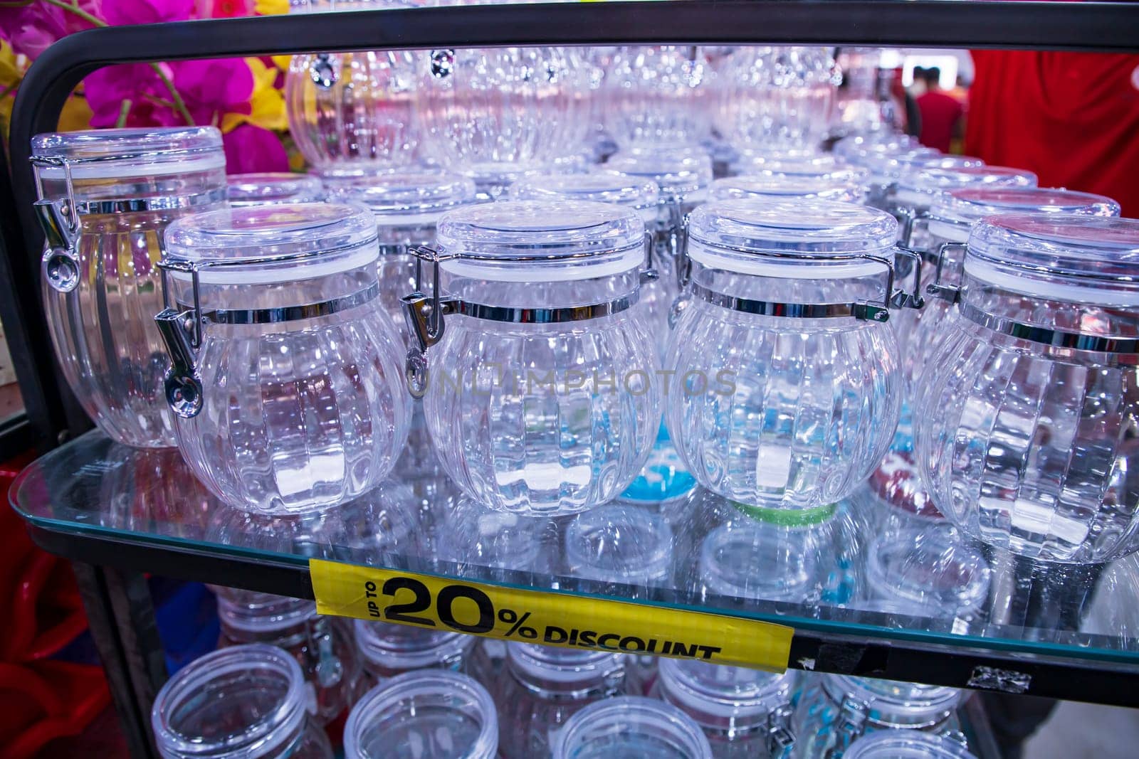 Transparent Plastic jur on a shelf in a supermarket, closeup of photo