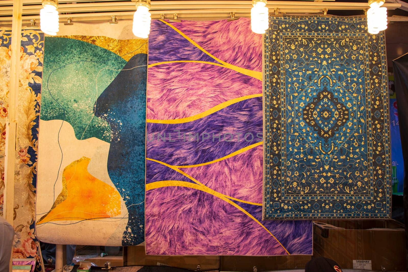 Colorful paintings carpets on display at the bazaar in Istanbul, Turkey