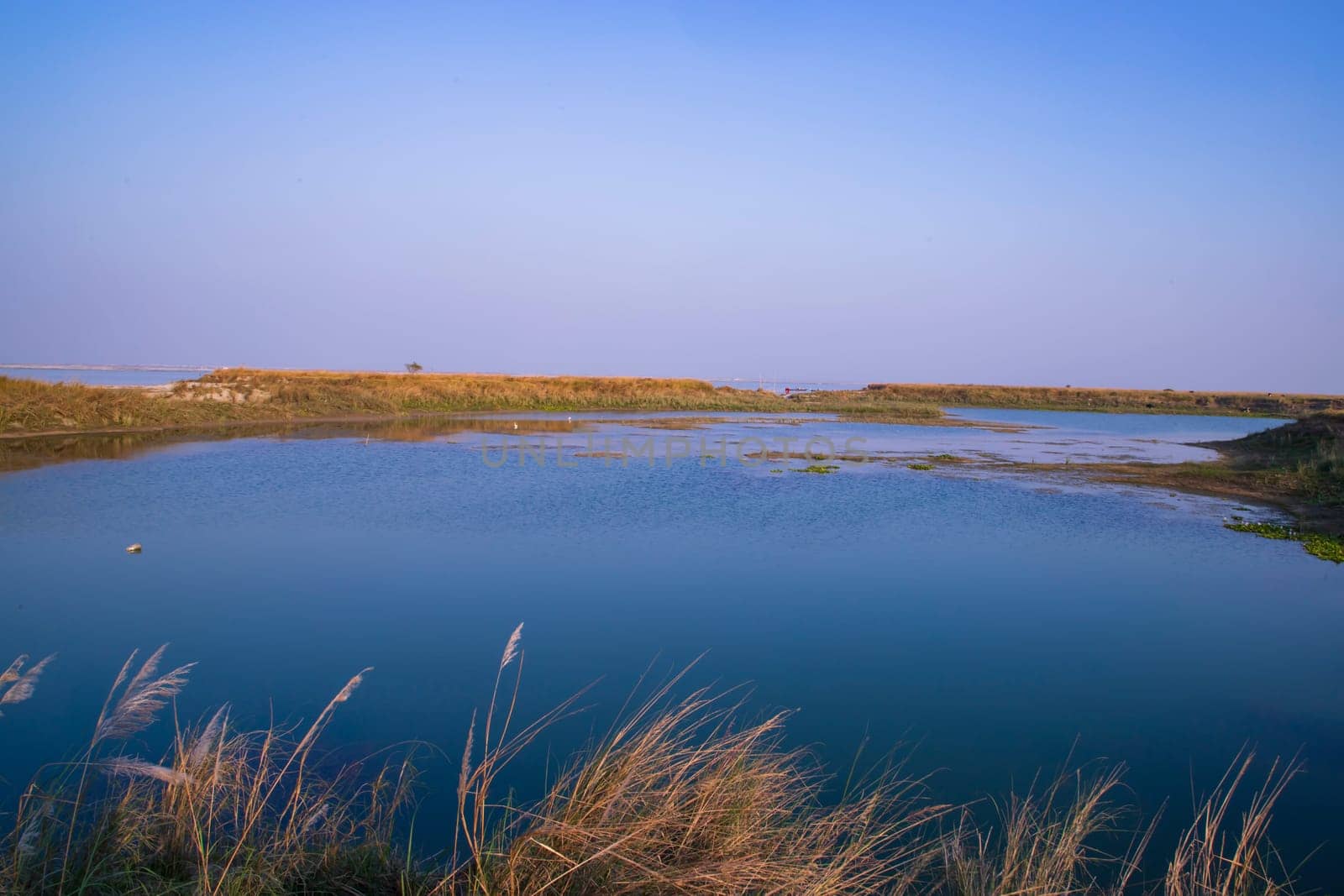 Crystal clear blue water lake landscape view nearby Padma river in Bangladesh