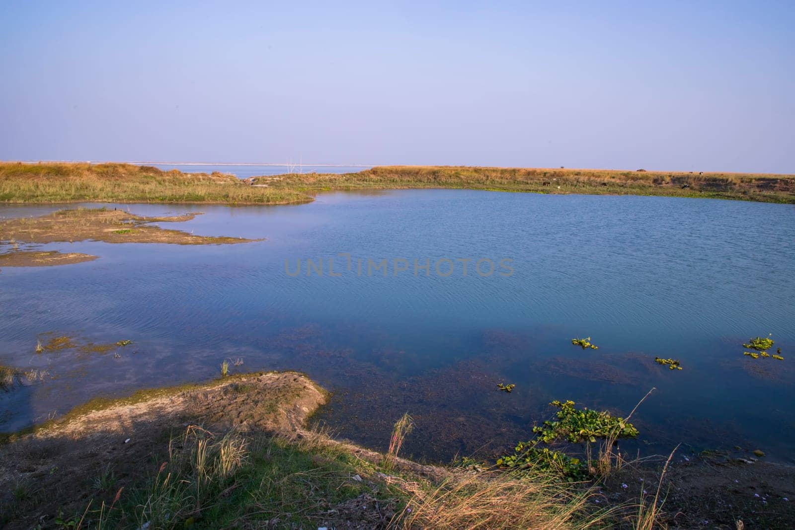 Crystal clear blue water lake landscape view nearby Padma river in Bangladesh