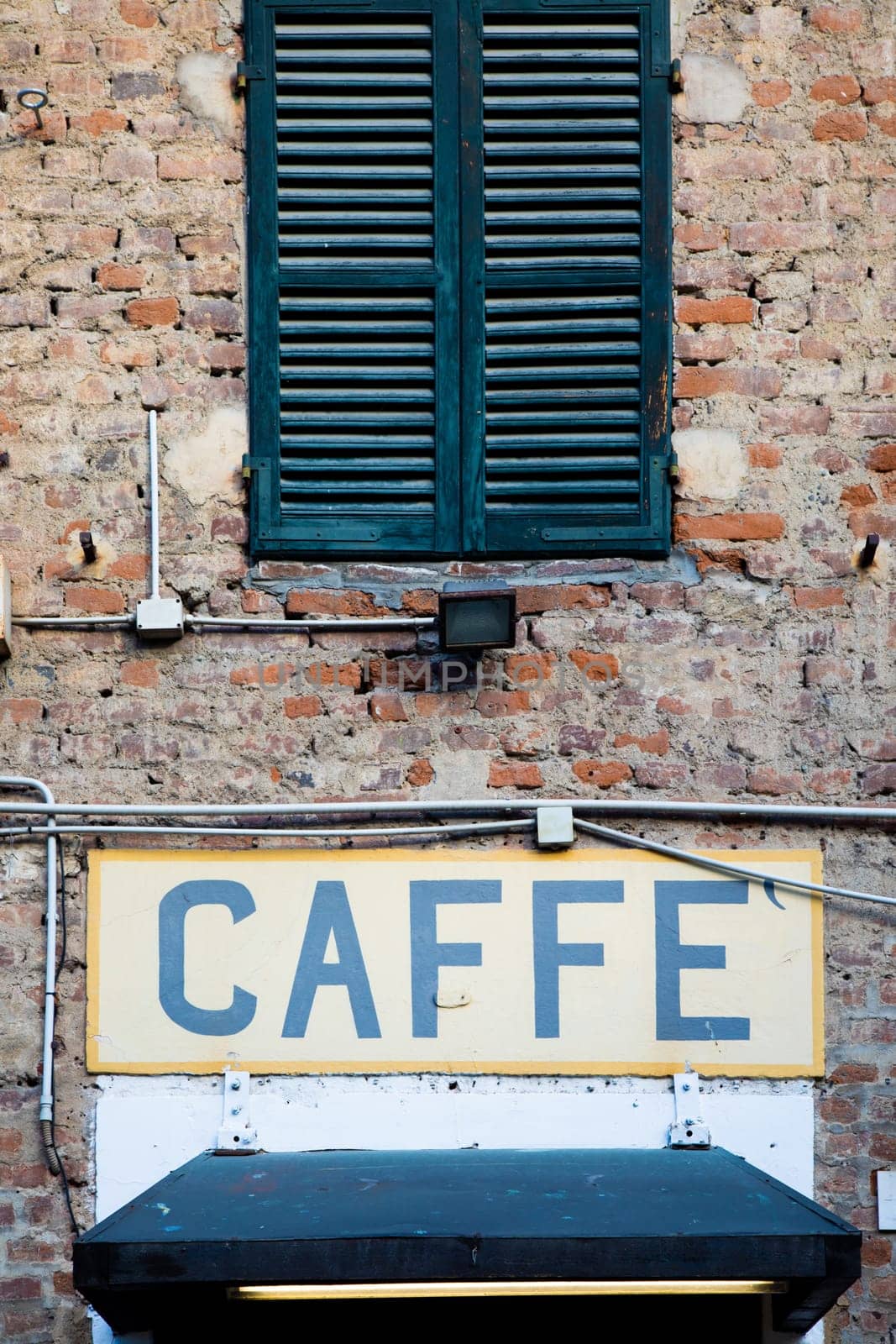 Old vintage coffee sign in Italy - Concept of retro, traditional Caffè design