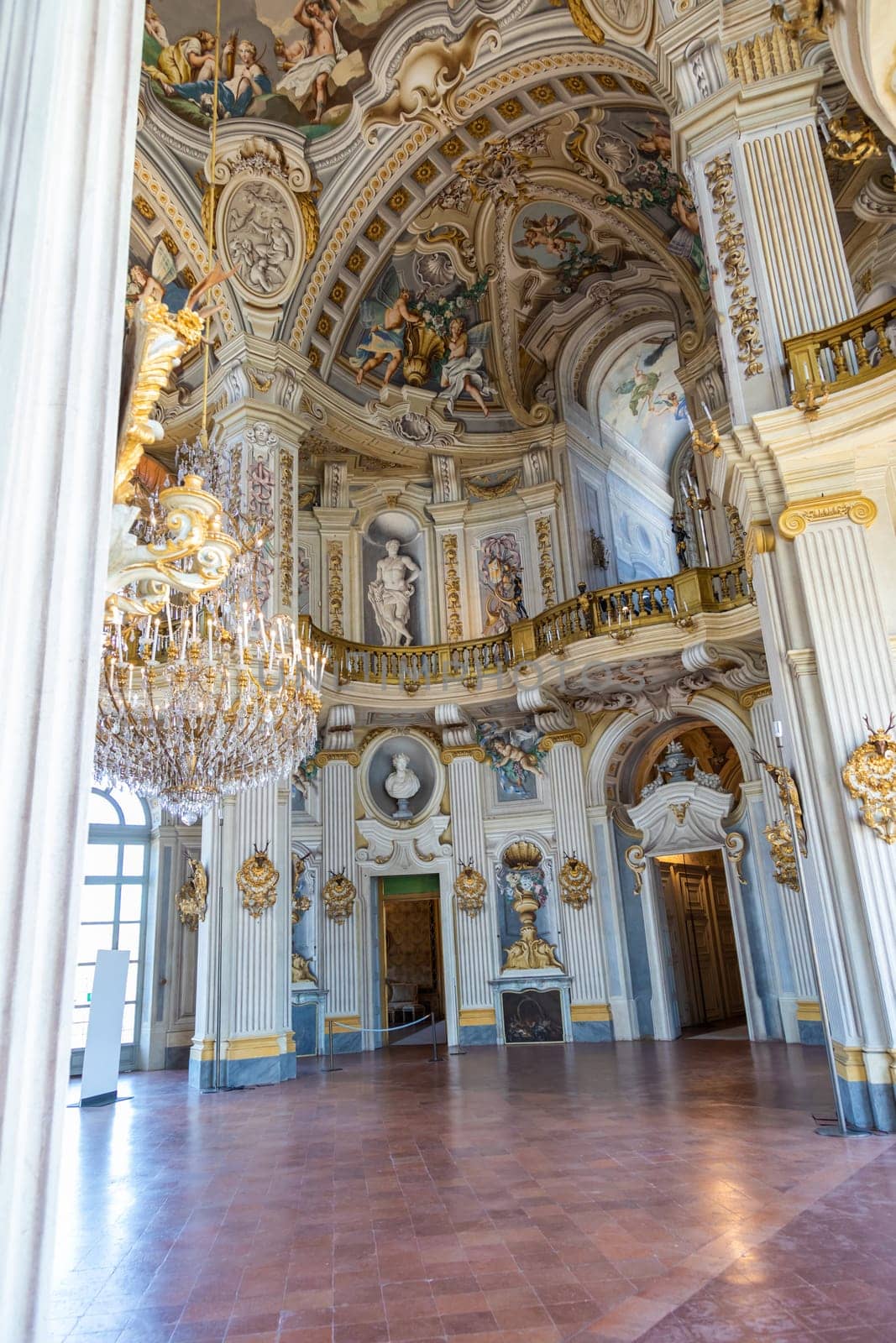 Italy, Stupinigi - January 2023: luxury interior of Royal Palace with baroque marbles and windows