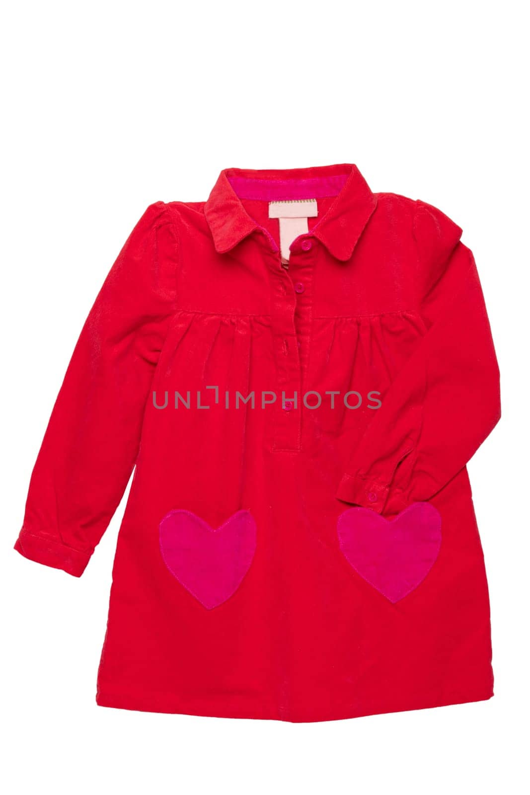 Summer dress isolated. A beautiful red girl's dress with attached heart shaped pockets and long sleeves isolated on white. Kids spring and autumn fashion.