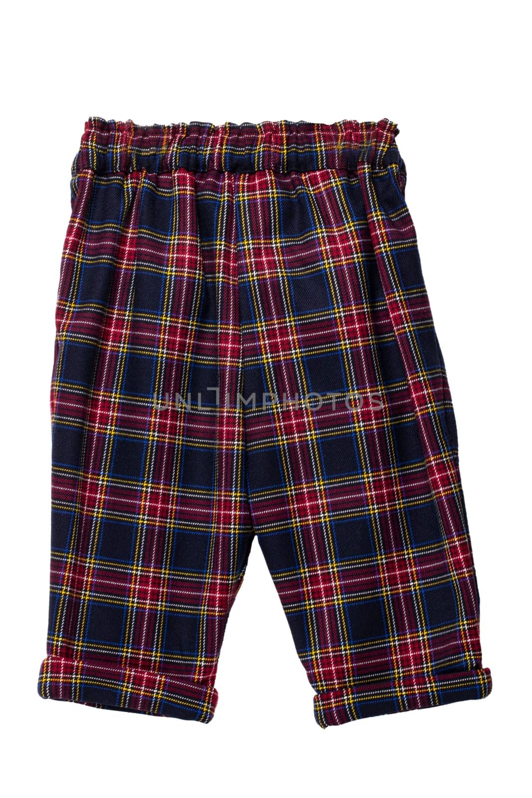 Summer shorts insulated. Close-up of a stylish fashionable plaid shorts with elasticated waistband. Back view. Tartan plaid fabric texture background.