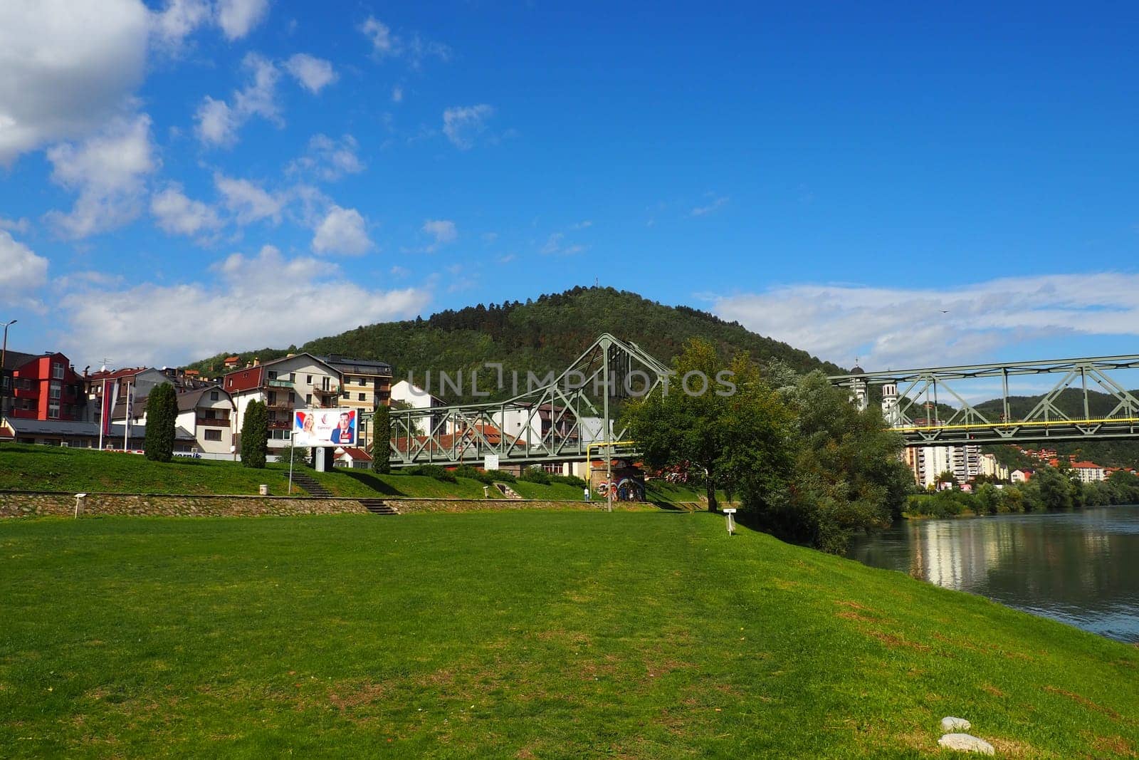 Zvornik, Bosnia and Herzegovina, Mali Zvornik, Serbia, September 29 2022 Drina river. Metal bridge across the Drina. Border point. View of coasts Serbia and BiH. The flow of water, residential houses